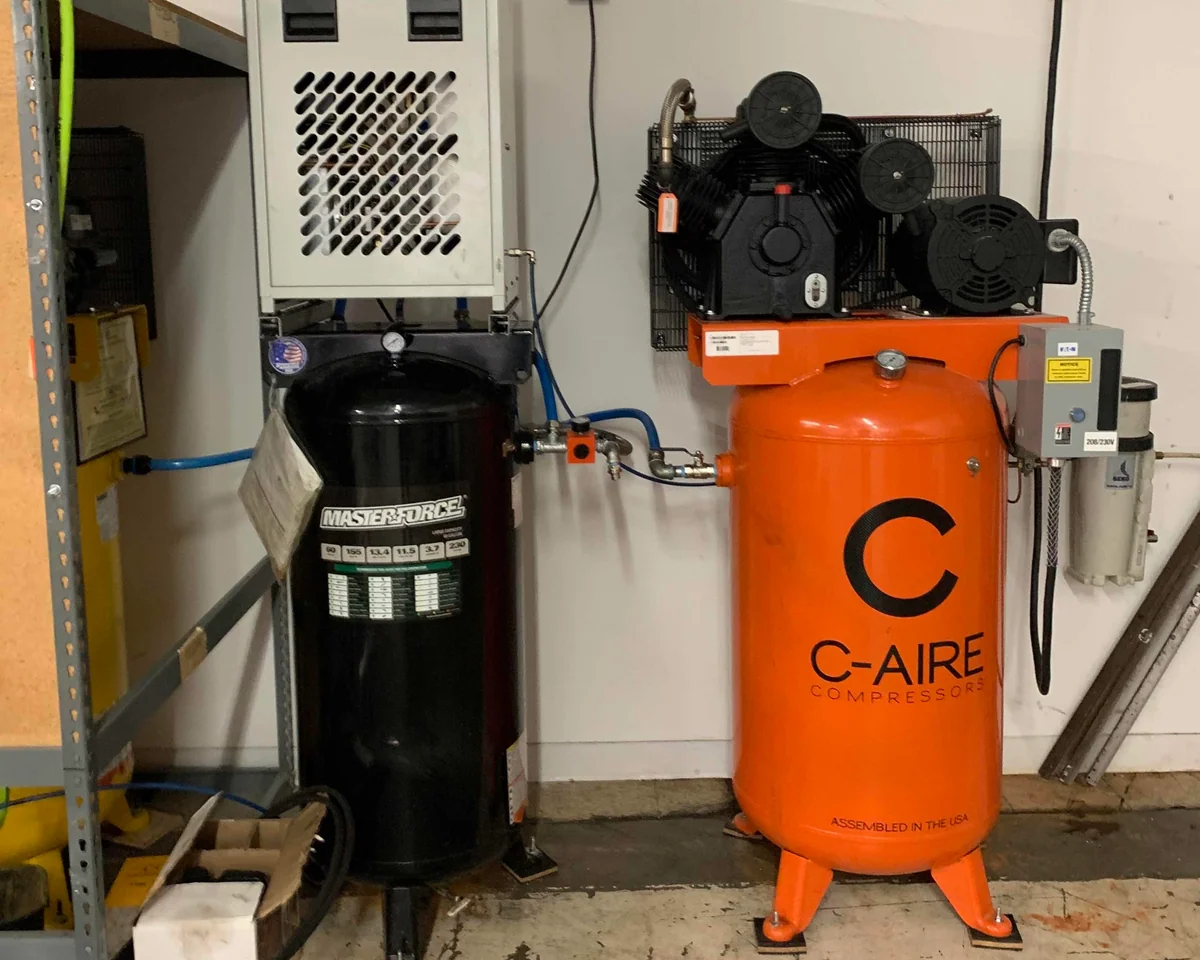 C-Aire 7.5 HP Vertical Piston Compressor installed at Clothing Factory in Saint Paul, MN